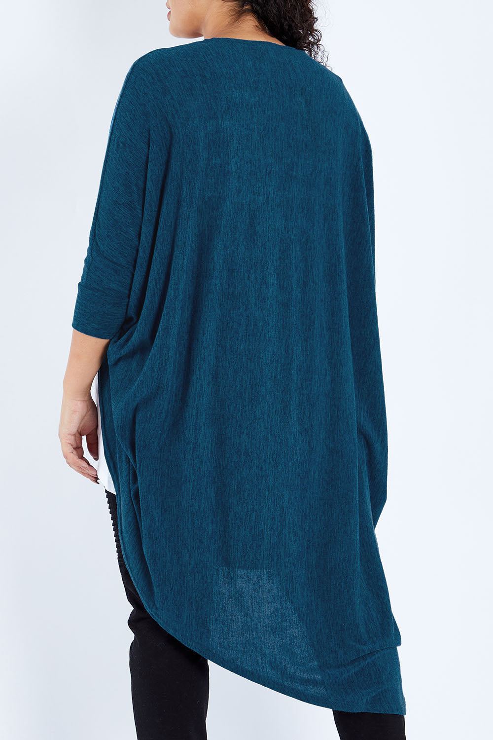 Model Sasha-Lee wearing size 16 of the Falling For You Cardi in colour Petrol (Blue), from the back
