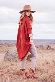 Model Marnee wearing size 10 of the Falling For You Cardi in colour Rust, from the front, showing the whole outfit