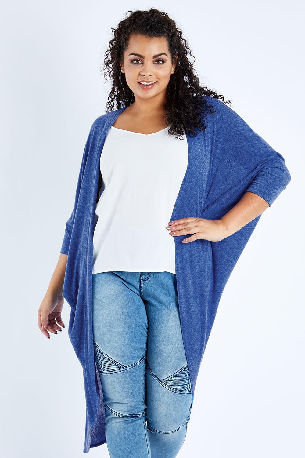 Model Sasha-Lee wearing size 16 of the Falling For You Cardi in colour Sapphire (Blue), from the front, cropped image