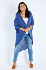 Model Sasha-Lee wearing size 16 of the Falling For You Cardi in colour Sapphire (Blue), from the front, showing the whole outfit