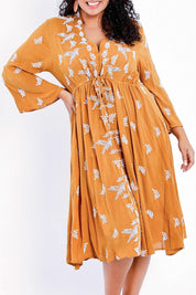 Model Sasha-Lee wearing size 16 of the Dancing With Birds Midi Dress in colour Clay, from the front, cropped image
