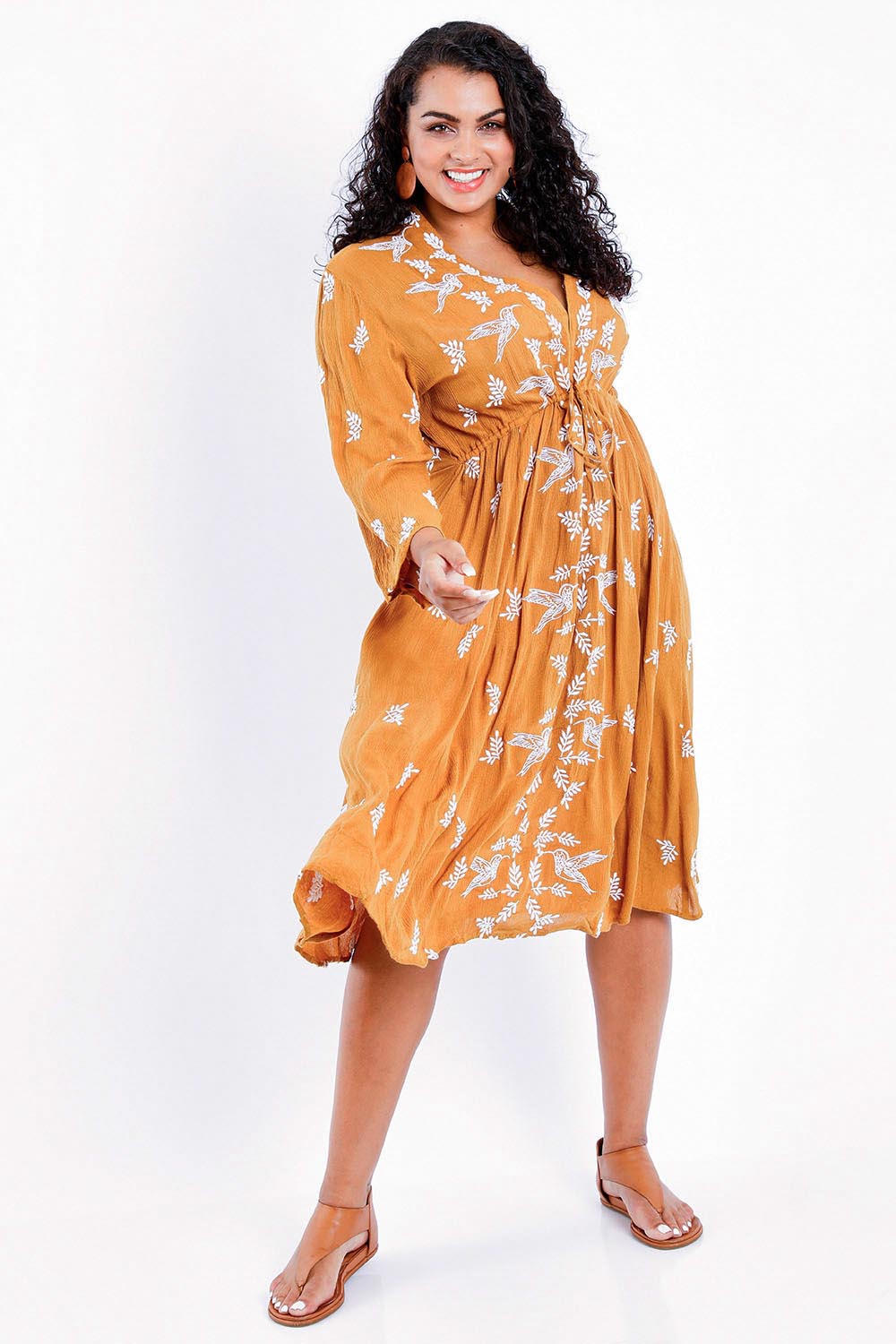 Model Sasha-Lee wearing size 16 of the Dancing With Birds Midi Dress in colour Clay, from the front, showing the whole outfit