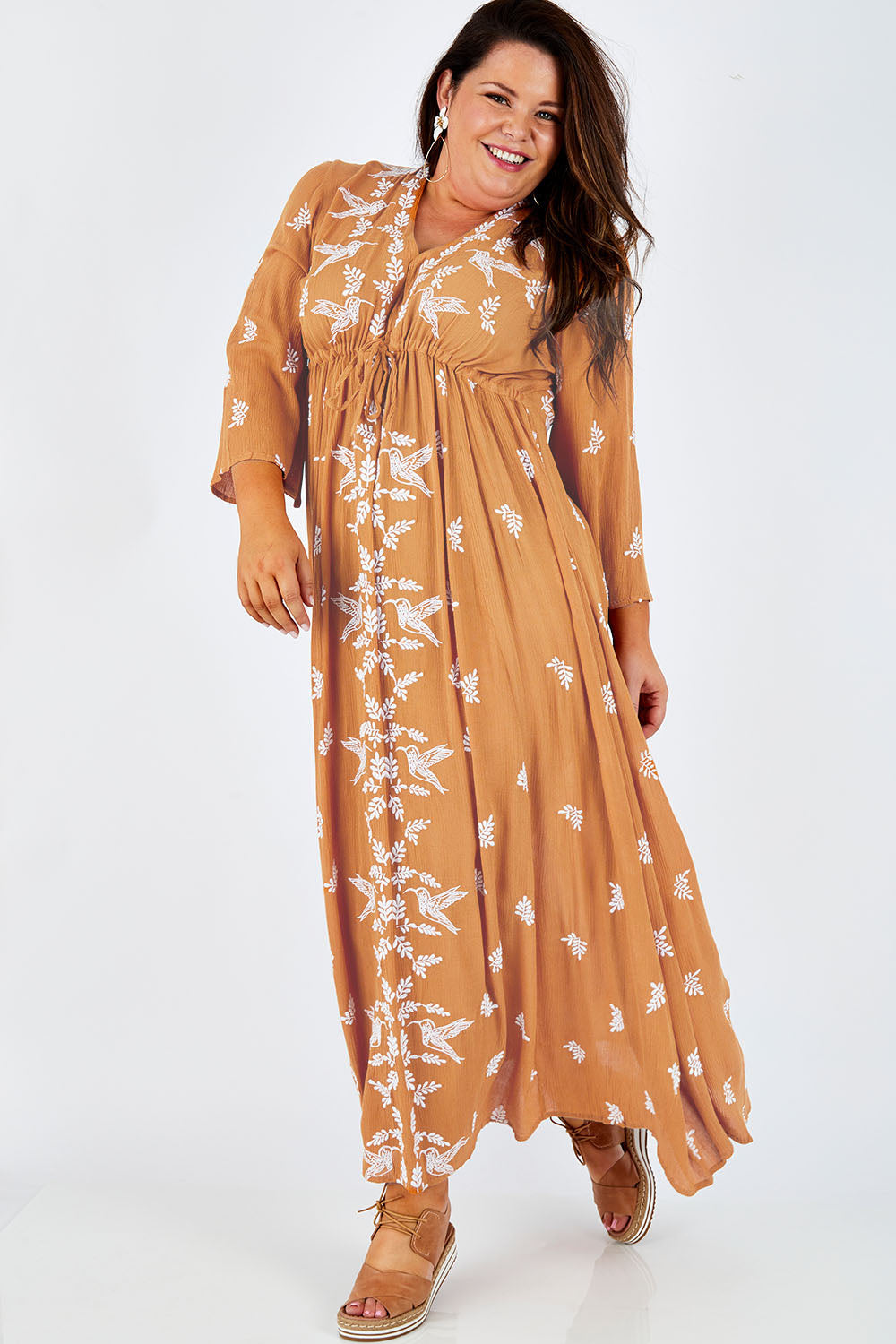 Model Stacey wearing size 16 of the Dancing With Birds Dress in colour Golden, from the front, showing the whole outfit