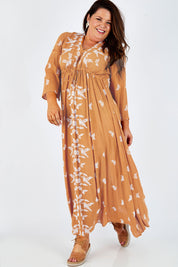 Model Stacey wearing size 16 of the Dancing With Birds Dress in colour Golden, from the front, showing the whole outfit