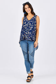 Model Georgia wearing size 10 of the Sugar Snaps Layer Tank in colour NavyLeaf (Blue), from the front, showing the whole outfit