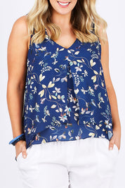 Model Jess wearing size 14 of the Sugar Snaps Layer Tank in colour NavyLeaf (Blue), from the front, cropped image