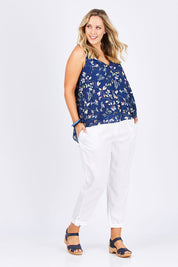 Model Jess wearing size 14 of the Sugar Snaps Layer Tank in colour NavyLeaf (Blue), from the front, showing the whole outfit