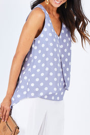 Model Gemma wearing size 10 of the Sugar Snaps Layer Tank in colour Dustyblue (Blue), from the front, cropped image