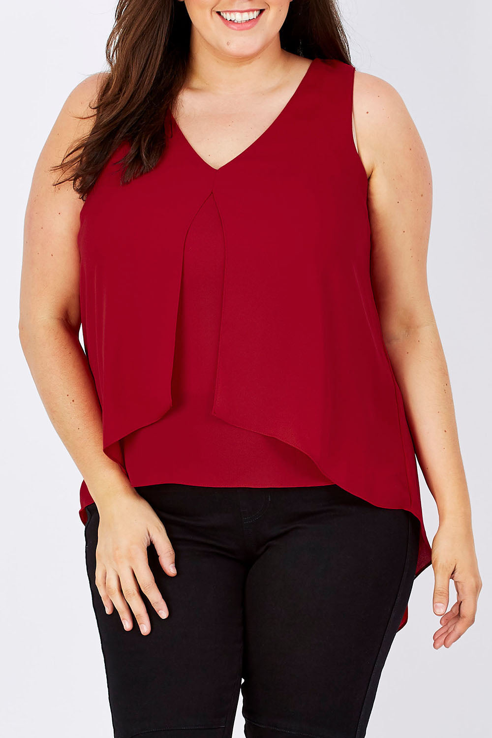 Model Mae wearing size 16 of the Sugar Snaps Layers Tank in colour Red (Red), from the front, cropped image