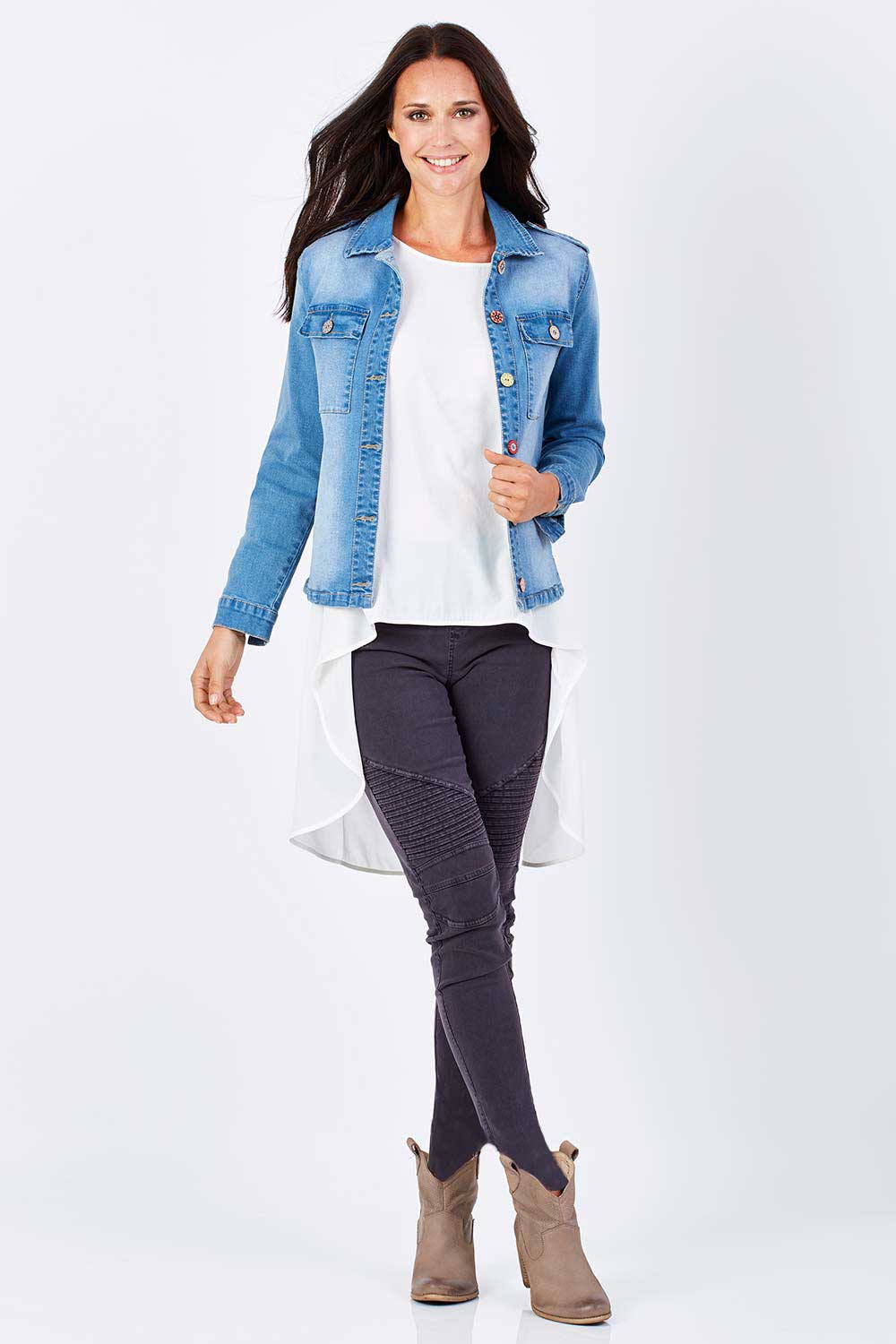 Model Clementine wearing size 8 of the Wild Tribe Stitched Jeggings in colour Indigo (Blue), from the front, showing the whole outfit