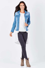 Model Clementine wearing size 8 of the Wild Tribe Stitched Jeggings in colour Indigo (Blue), from the front, showing the whole outfit