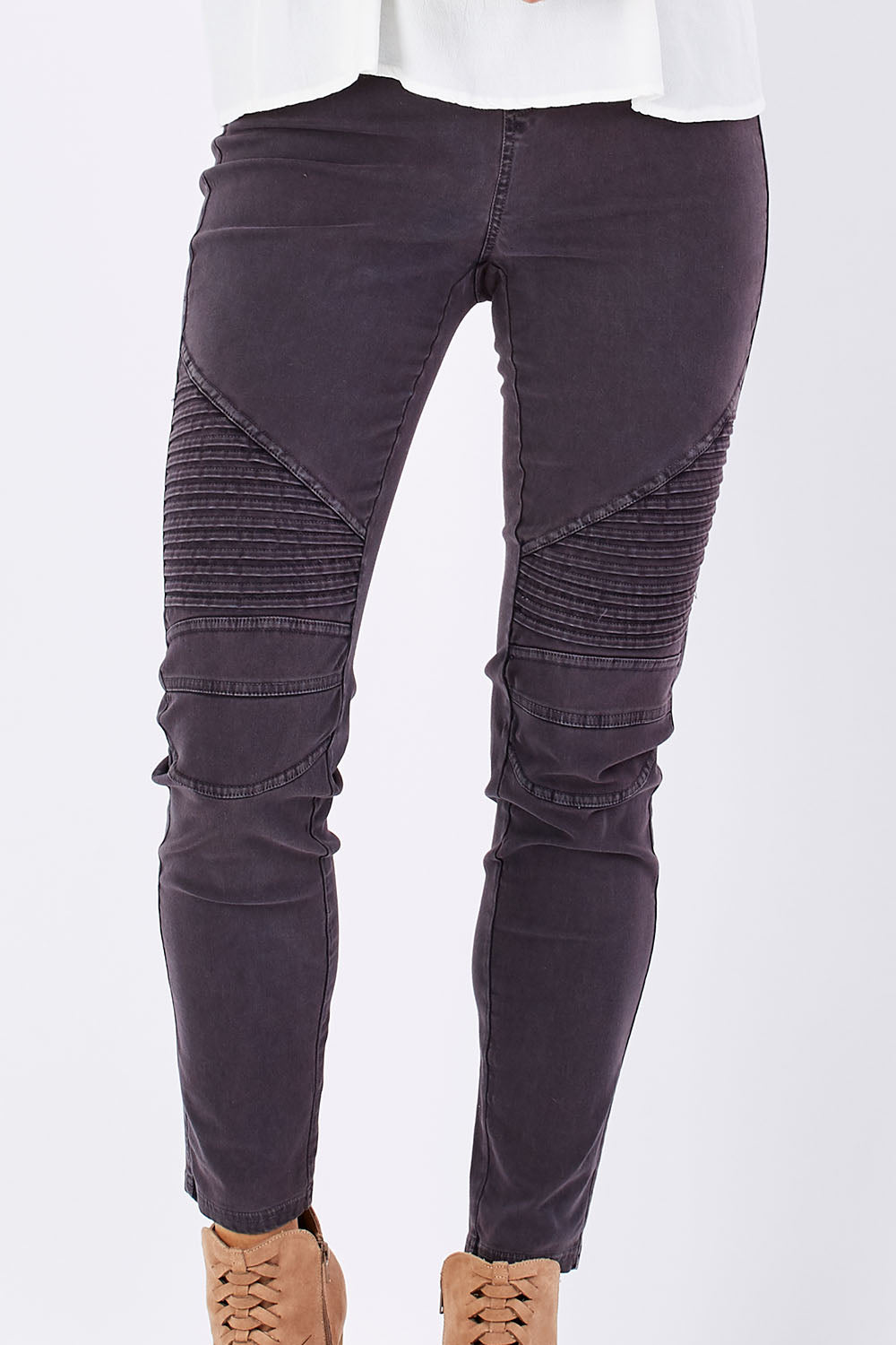 Model Georgia wearing size 10 of the Wild Tribe Stitched Jeggings in colour Indigo (Blue), from the front, cropped image