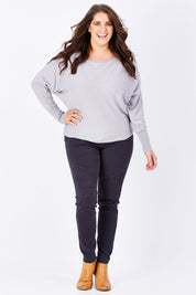 Model Mae wearing size 16 of the Wild Tribe Stitched Jeggings in colour Indigo (Blue), from the front, showing the whole outfit