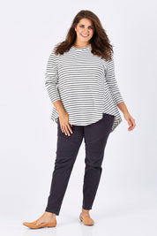 Model Mae wearing size 18 of the Wild Tribe Stitched Jeggings in colour Indigo (Blue), from the front, showing the whole outfit