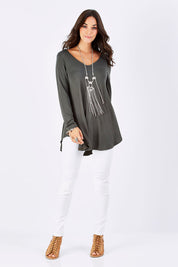 Model Georgia wearing size 10 of the Long Sleeve Softly Swinging Bamboo Tee in colour Combat (Black), from the front, showing the whole outfit