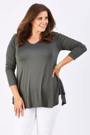 Model Mae wearing size 18 of the Long Sleeve Softly Swinging Bamboo Tee in colour Combat (Black), from the front, cropped image
