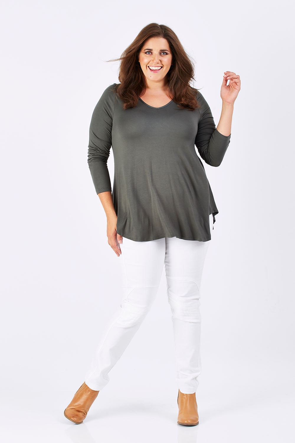 Model Mae wearing size 18 of the Long Sleeve Softly Swinging Bamboo Tee in colour Combat (Black), from the front, showing the whole outfit