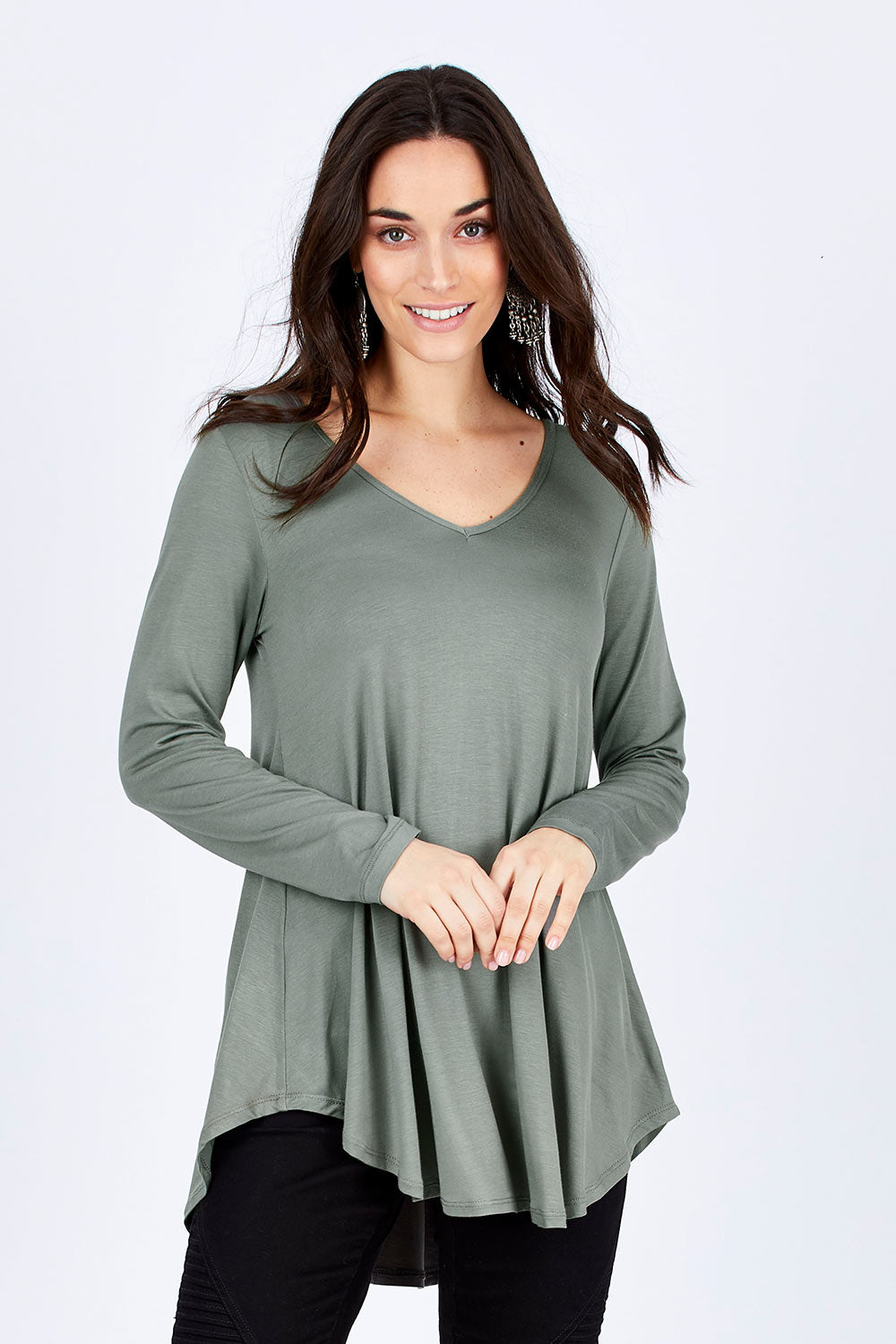 Model Georgia wearing size 10 of the Long Sleeve Softly Swinging Bamboo Tee in colour Fern (Green), from the front, cropped image