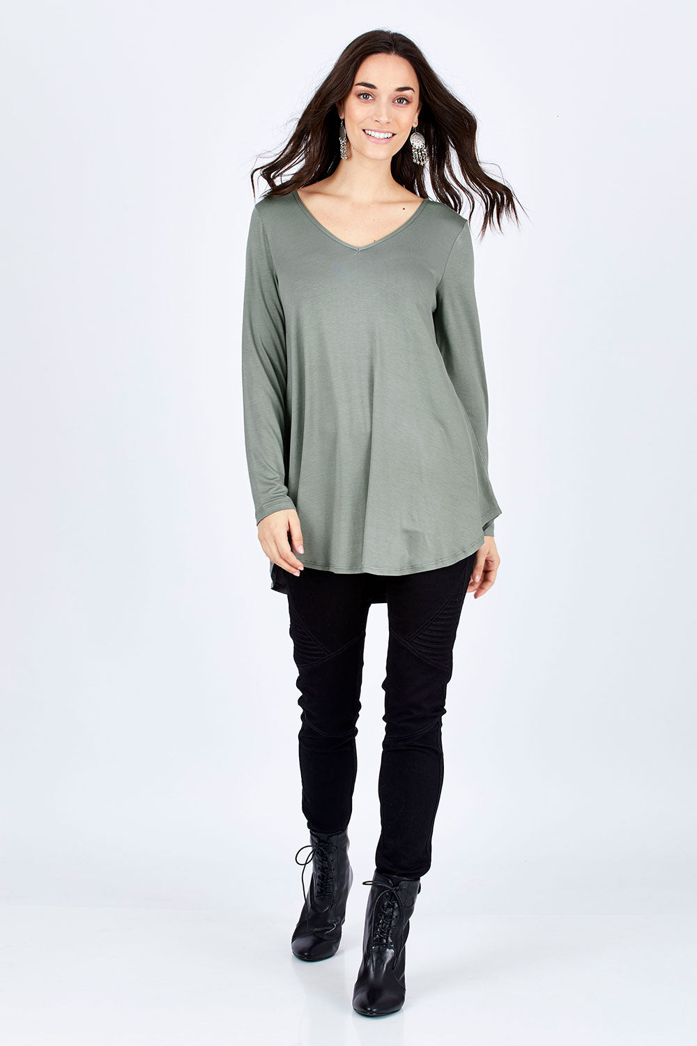 Model Georgia wearing size 10 of the Long Sleeve Softly Swinging Bamboo Tee in colour Fern (Green), from the front, showing the whole outfit