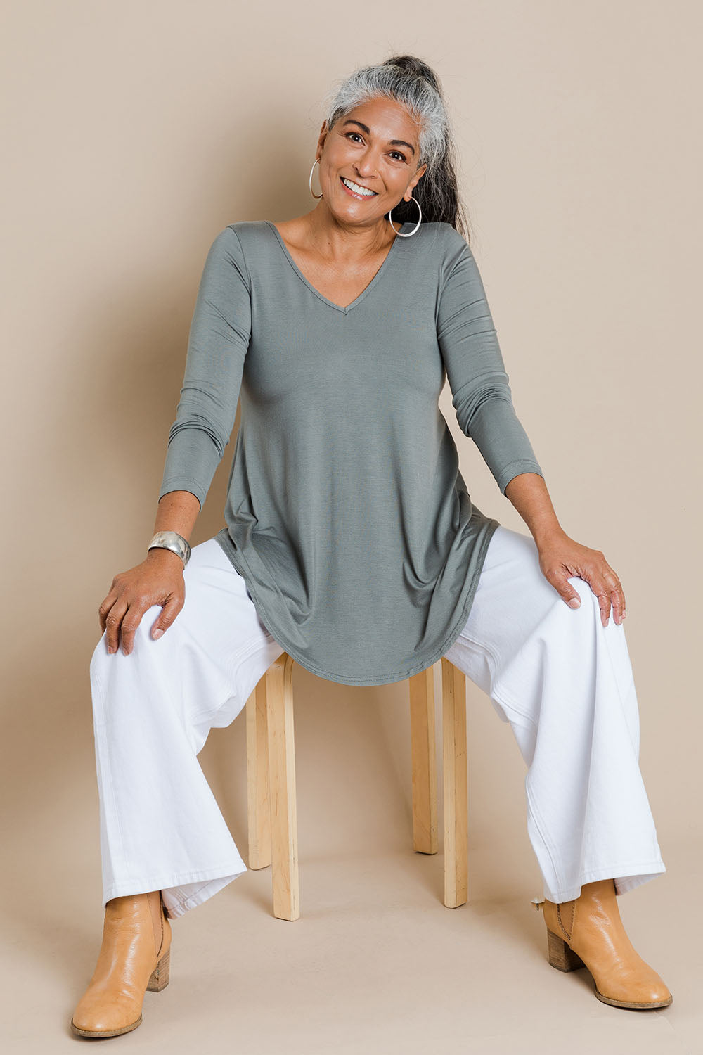 Model Nadine wearing size 10 of the Long Sleeve Softly Swinging Bamboo Tee in colour Fern (Green), from the front, showing the whole outfit