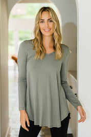Model Tegan wearing size 10 of the Long Sleeve Softly Swinging Bamboo Tee in colour Fern (Green), from the front, showing the whole outfit