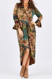 Model Tia wearing size 14 of the Cloud Dancer Dress in colour Rust, from the front, cropped image