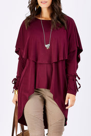 Model Georgia wearing size 10 of the Cape Horn Tunic in colour Scarlet (Purple), from the front, cropped image