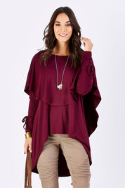 Model Georgia wearing size 10 of the Cape Horn Tunic in colour Scarlet (Purple), from the front, cropped image