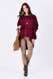 Model Georgia wearing size 10 of the Cape Horn Tunic in colour Scarlet (Purple), from the front, showing the whole outfit