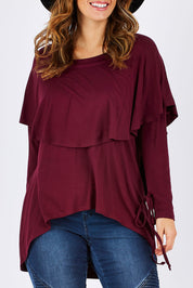 Model Laura wearing size 12 of the Cape Horn Tunic in colour Scarlet (Purple), from the front, cropped image