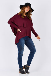 Model Laura wearing size 12 of the Cape Horn Tunic in colour Scarlet (Purple), from the front, showing the whole outfit