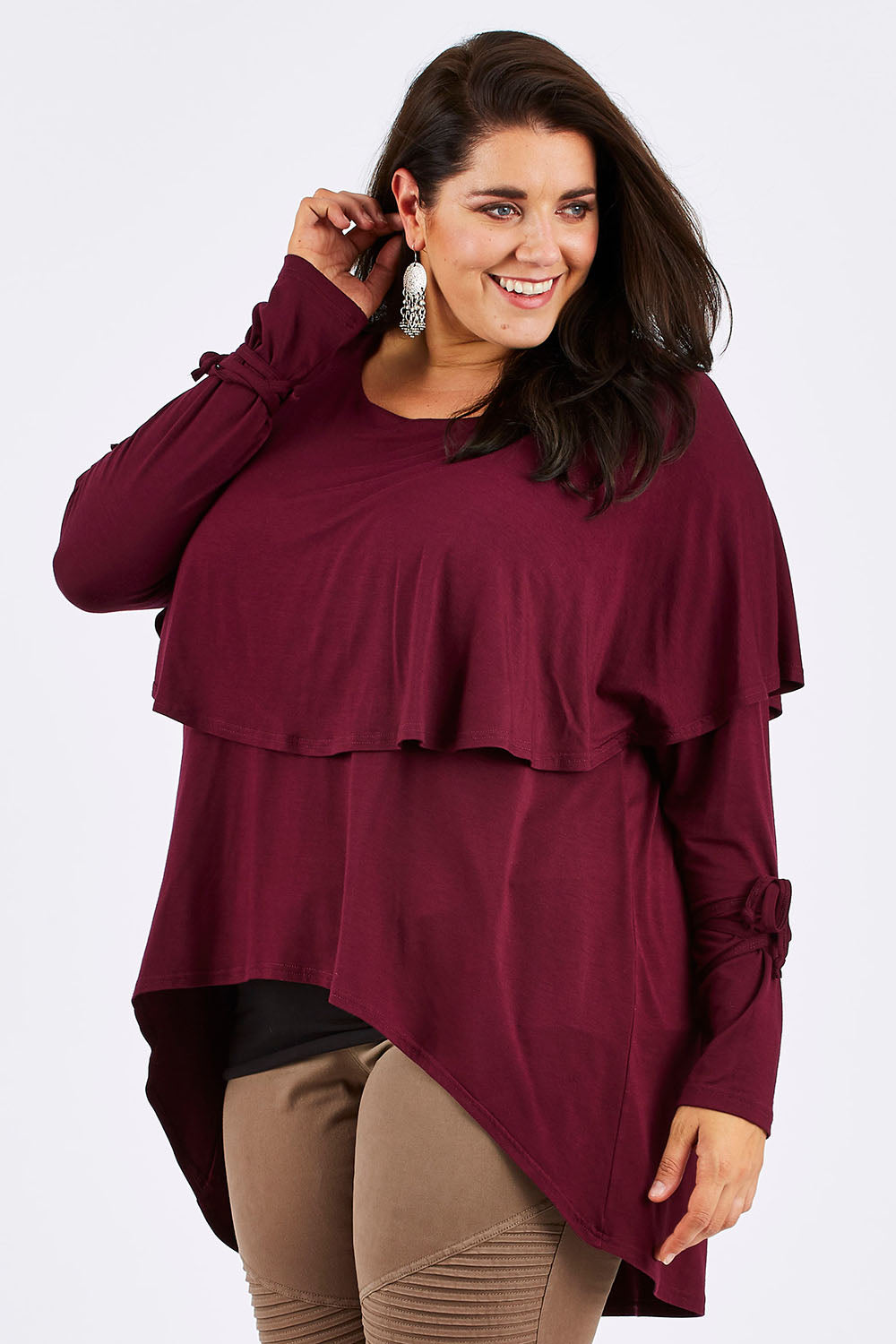 Model Mae wearing size 18 of the Cape Horn Tunic in colour Scarlet (Purple), from the front, cropped image