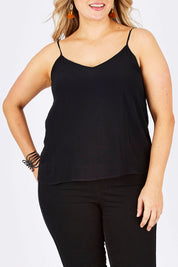Model Ljubenka wearing size 18 of the Runaway Top in colour JetBlack (Black), from the front, cropped image