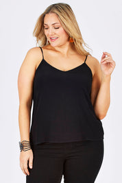 Model Ljubenka wearing size 18 of the Runaway Top in colour JetBlack (Black), from the front, cropped image