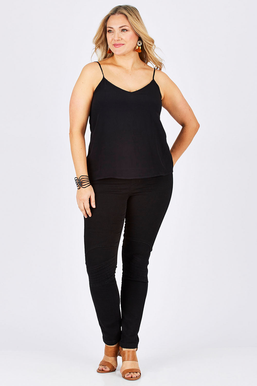 Model Ljubenka wearing size 18 of the Runaway Top in colour JetBlack (Black), from the front, showing the whole outfit