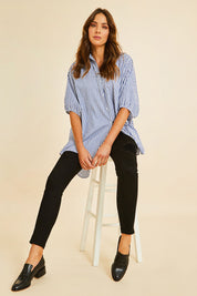 Model Madeline wearing size 10 of the Wild Plains Stitched Jeggings in colour Black (Black), from the front, showing the whole outfit