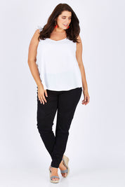 Model Mae wearing size 18 of the Wild Plains Stitched Jeggings in colour Black (Black), from the front, showing the whole outfit