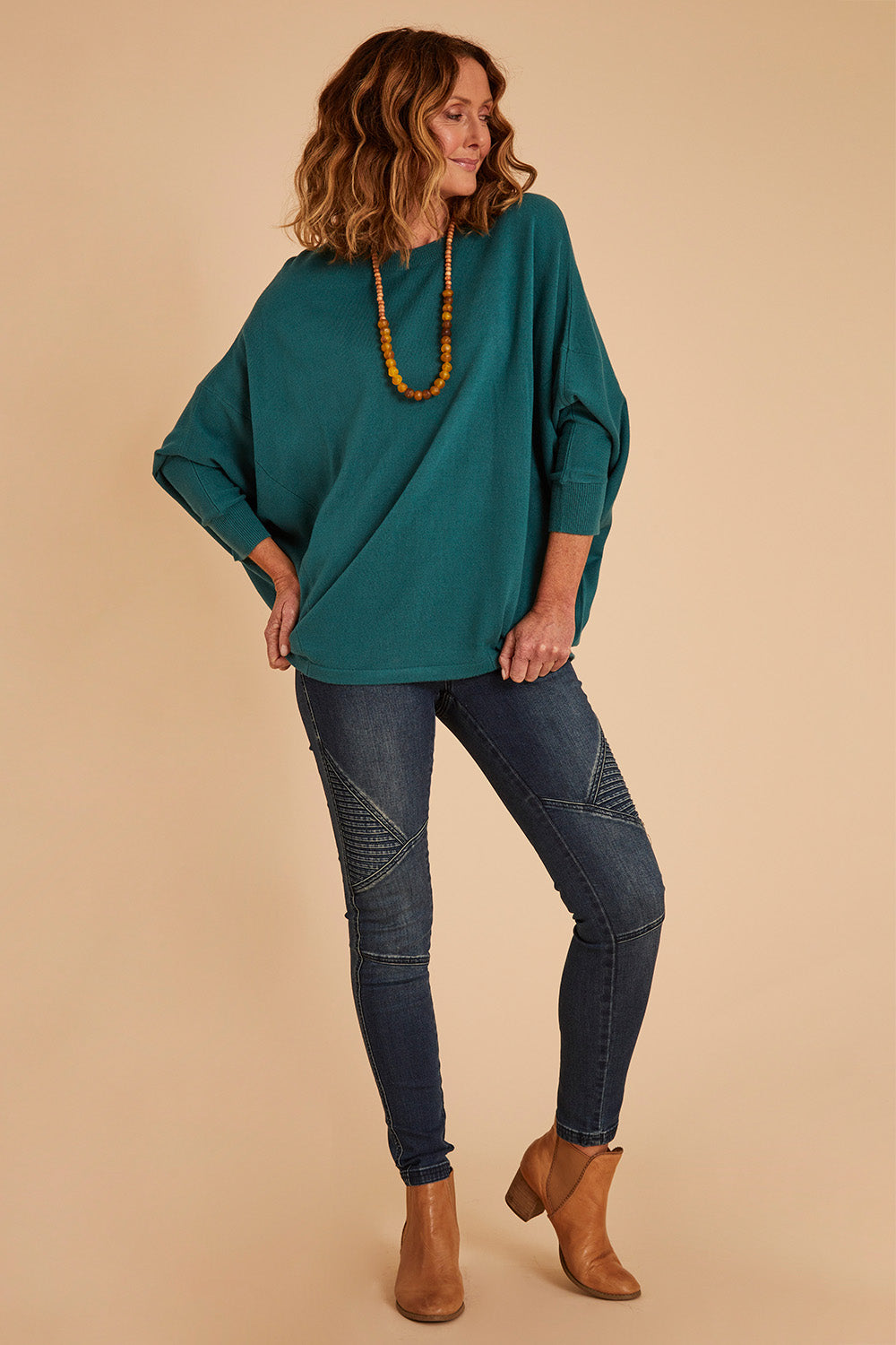 Model Emma wearing size 10 of the Wild Plains Stitched Jeggings in colour Denim (Blue), from the front, showing the whole outfit