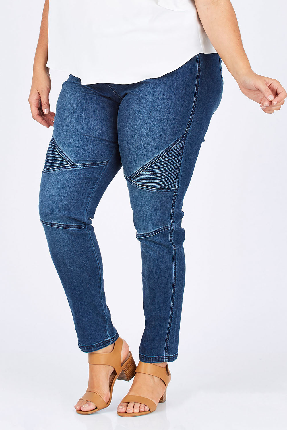 Model Mae wearing size 18 of the Wild Plains Stitched Jeggings in colour Denim (Blue), from the front, showing the whole outfit