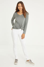 Model Cara wearing size 10 of the Wild Plains Stitched Jeggings in colour White (White), from the front, showing the whole outfit
