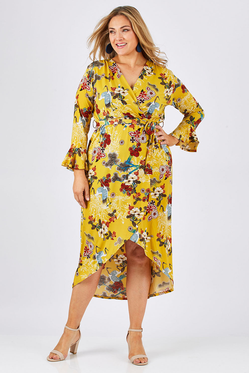 Model Ljubenka wearing size 18 of the Spring Blossom Dress in colour Dijon, from the front, showing the whole outfit