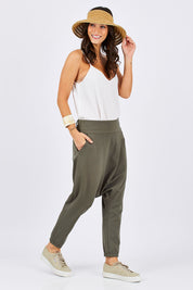 Model Georgia wearing size 10 of the Relax With Me Pants in colour Moss (Green), from the front, showing the whole outfit