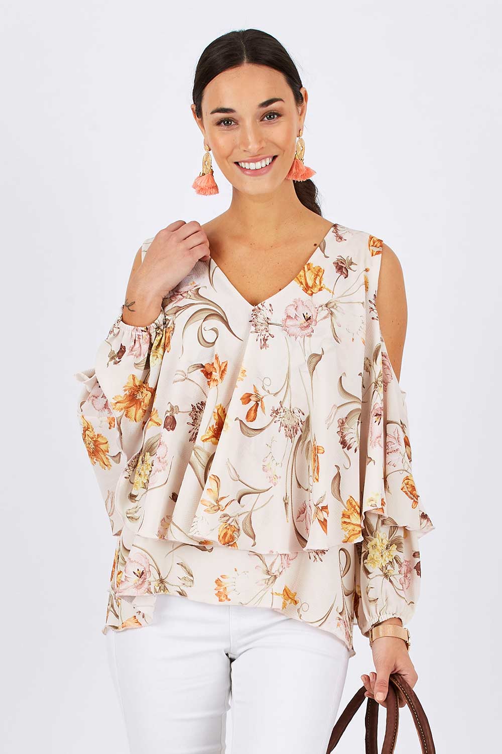 Model Georgia wearing size 10 of the Flouncing Around Blouse in colour Fleur (Pink), from the front, cropped image