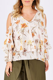 Model Jess wearing size 14 of the Flouncing Around Blouse in colour Fleur (Pink), from the front, cropped image