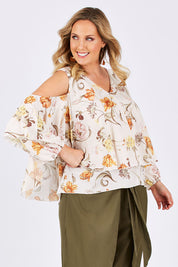 Model Jess wearing size 14 of the Flouncing Around Blouse in colour Fleur (Pink), from the front, cropped image