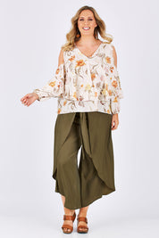 Model Jess wearing size 14 of the Flouncing Around Blouse in colour Fleur (Pink), from the front, showing the whole outfit