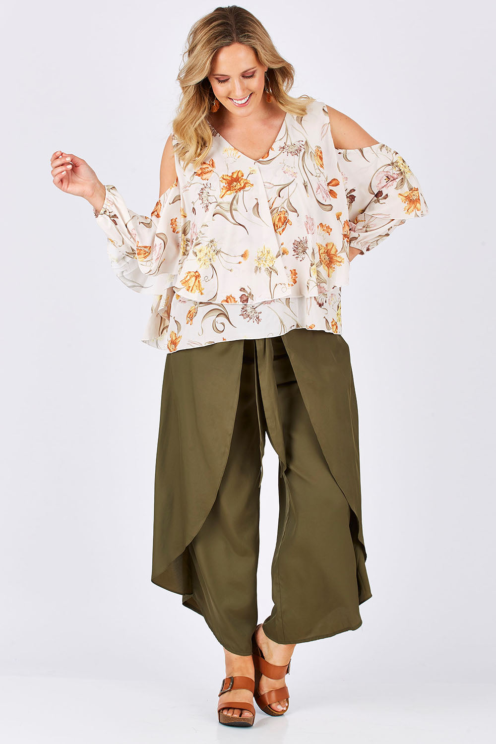 Model Jess wearing size 14 of the Flouncing Around Blouse in colour Fleur (Pink), from the front, showing the whole outfit