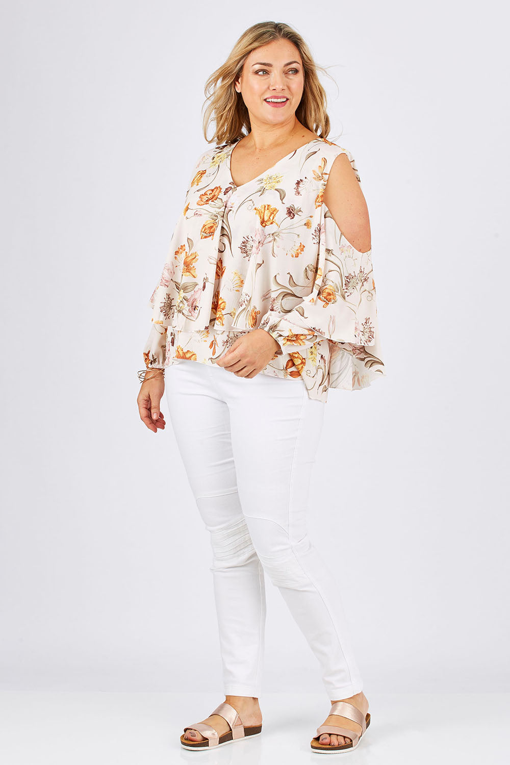 Model Ljubenka wearing size 18 of the Flouncing Around Blouse in colour Fleur (Pink), from the front, showing the whole outfit