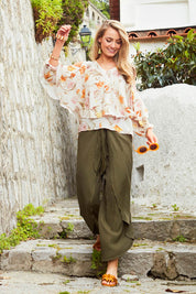 Model Marnee wearing size 10 of the Flouncing Around Blouse in colour Fleur (Pink), from the front, showing the whole outfit
