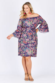 Model Jess wearing size 14 of the Ti Amo Dress in colour BluePink (Blue), from the front, showing the whole outfit
